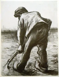 後ろから見た農民を掘る